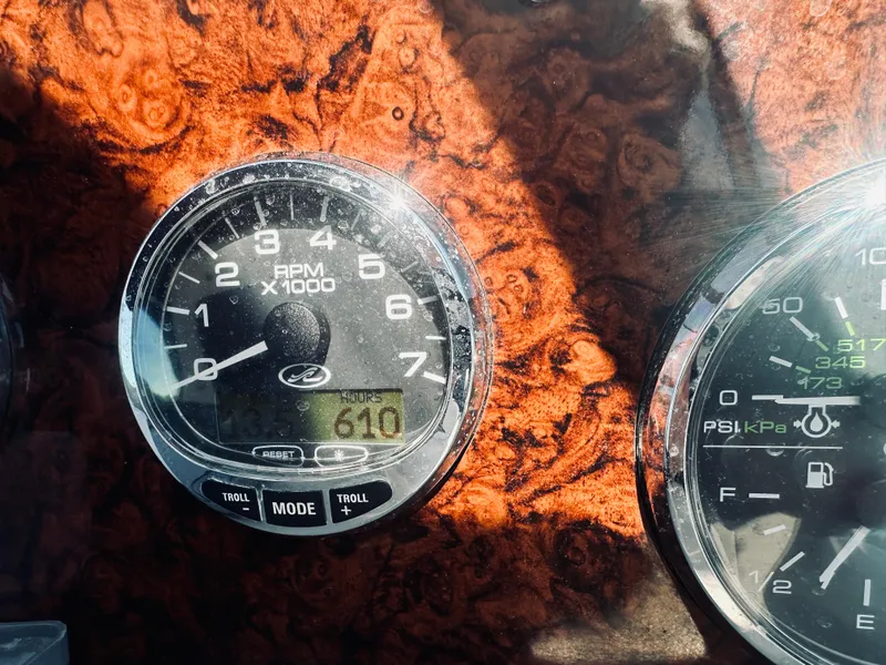 Slide: The Image of Close-up of 2006 Sea Ray 320 Sundancer dashboard gauges, showing RPM and engine hours. - 27