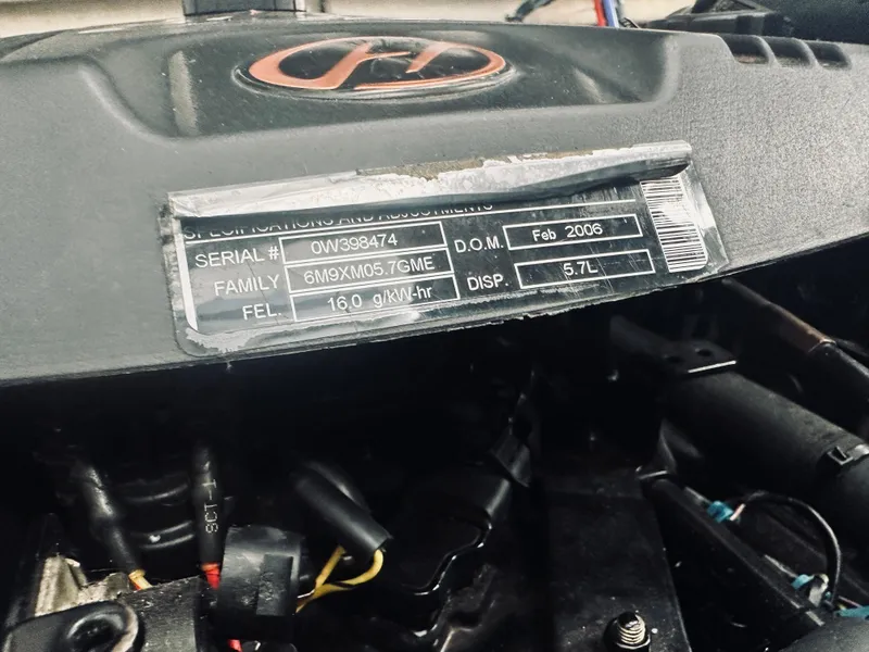 Slide: The Image of Engine compartment of 2006 Sea Ray 320 Sundancer, showing serial and specifications label. - 31