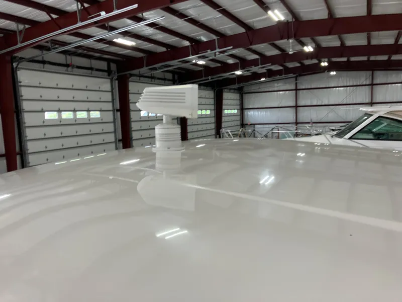 Slide: The Image of 2012 Striper 2901 Walkaround I/O in a spacious indoor storage facility. - 10