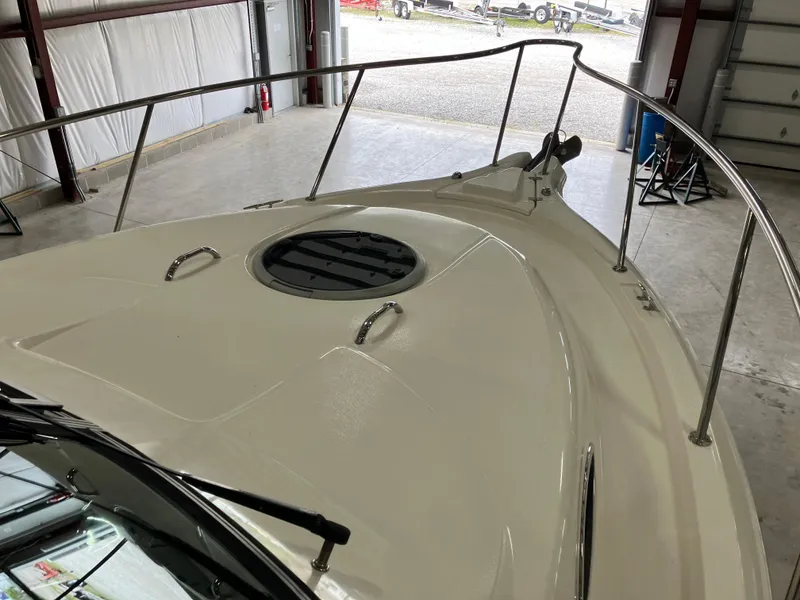 Slide: The Image of 2012 Striper 2901 Walkaround I/O boat deck in a storage facility. - 15