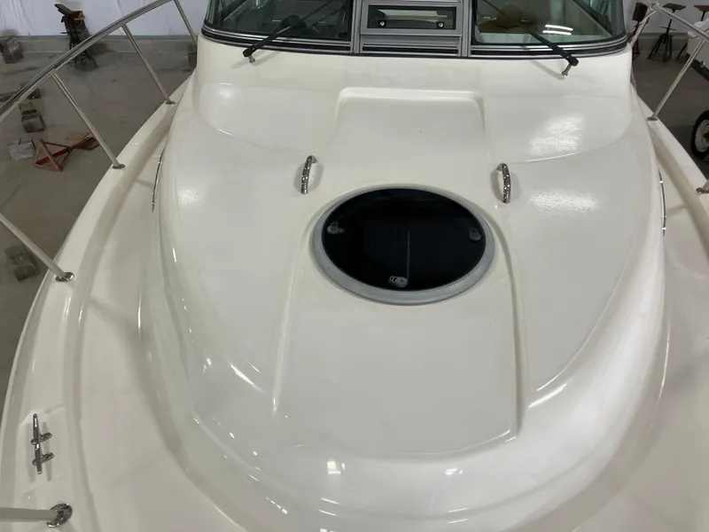 Slide: The Image of 2012 Striper 2901 Walkaround I/O boat deck with circular hatch and railing. - 16