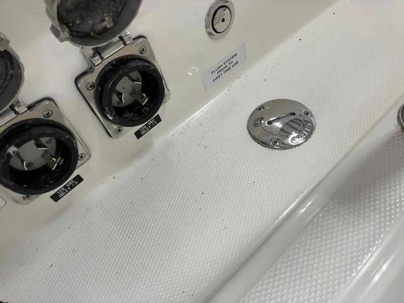 Slide: The Image of 2012 Striper 2901 Walkaround I/O boat deck with power outlets and fittings. - 19