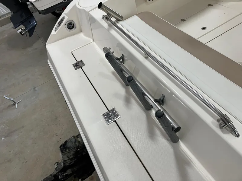 Slide: The Image of 2012 Striper 2901 Walkaround I/O boat deck with rod holders and stainless steel railing. - 21