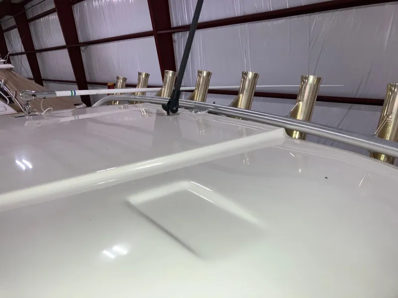 Slide: The Image of 2012 Striper 2901 Walkaround I/O boat deck with rod holders in storage. - 25