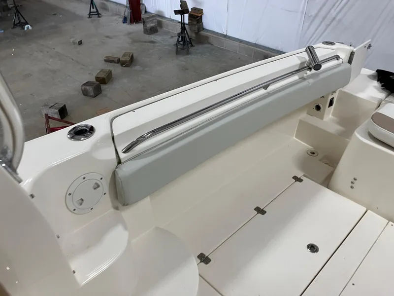 Slide: The Image of 2012 Striper 2901 Walkaround I/O boat interior with seating and storage compartments. - 26