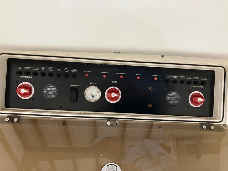 Slide: The Image of Control panel of 2012 Striper 2901 Walkaround I/O boat with switches and gauges. - 27