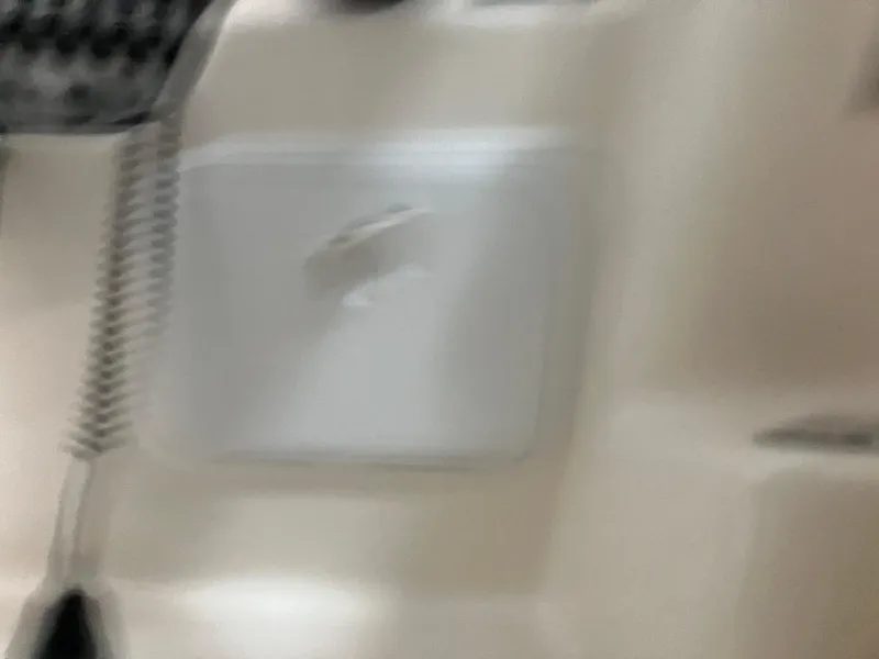 Slide: The Image of Blurred interior view of a 2012 Striper 2901 Walkaround I/O boat. - 29