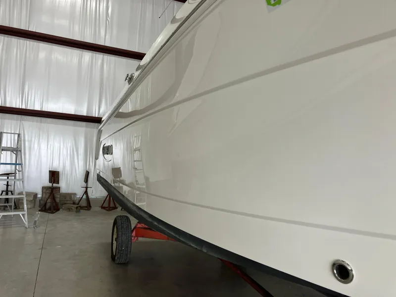 Slide: The Image of 2012 Striper 2901 Walkaround I/O boat in storage, side view. - 4