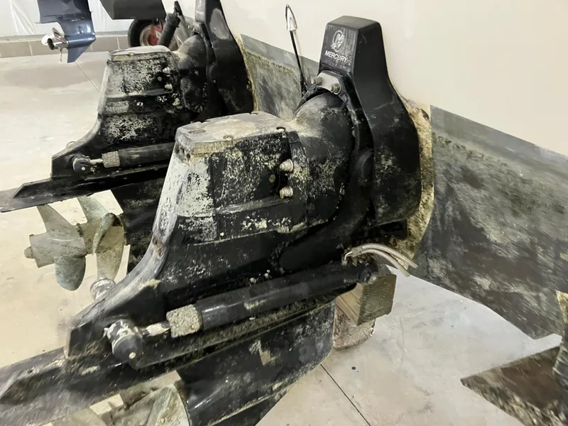 Slide: The Image of 2012 Striper 2901 Walkaround I/O boat engine with visible wear and marine growth. - 49