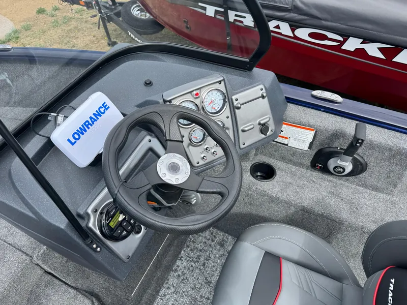 Slide: The Image of 2025 Tracker Pro Guide V-175 WT boat dashboard with steering wheel and Lowrance device. - 14