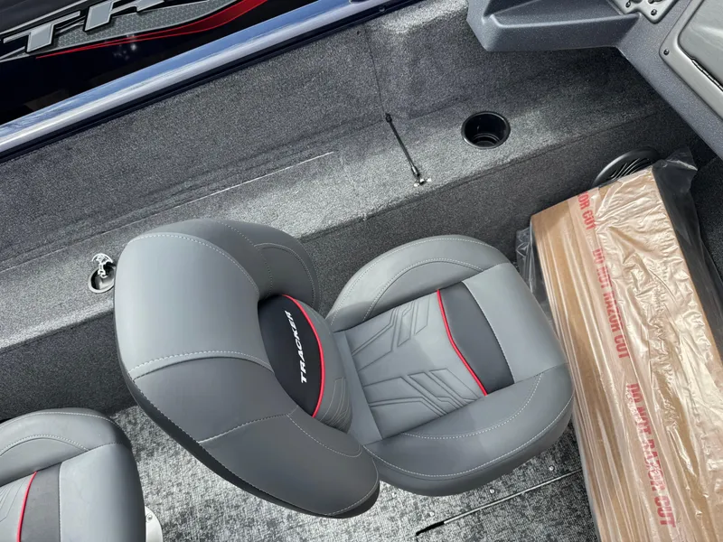 Slide: The Image of 2025 Tracker Pro Guide V-175 WT boat interior with gray seating and storage area. - 15