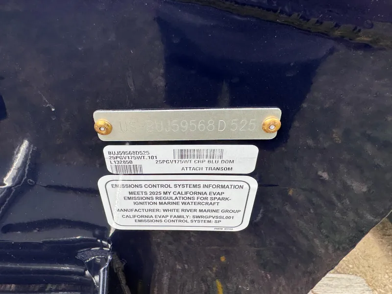 Slide: The Image of 2025 Tracker Pro Guide V-175 WT boat transom with emissions control information plate. - 3