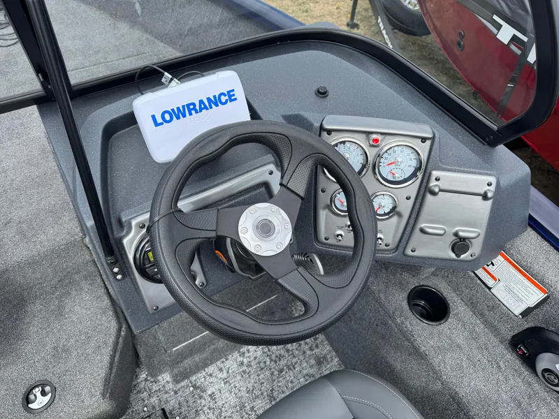 Slide: The Image of 2025 Tracker Pro Guide V-175 WT boat dashboard with steering wheel and Lowrance device. - 7