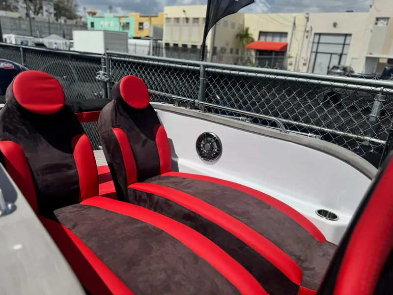 Slide: The Image of Red and black seats in a 2025 Car Off-shore Fiat 500 Abarth boat. - 8