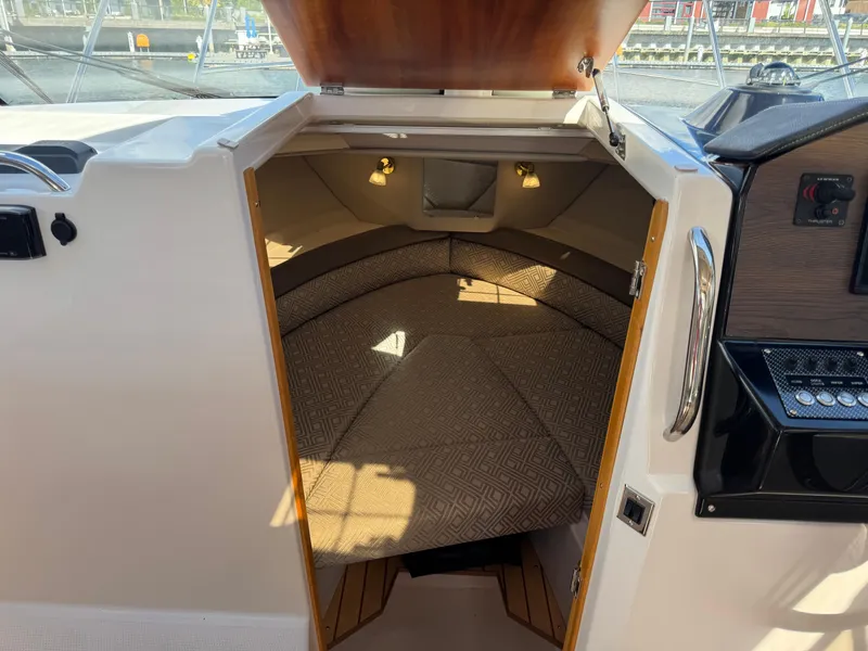 Slide: The Image of 2018 Cutwater C-242 Coupe cabin interior with cozy seating and ambient lighting. - 20