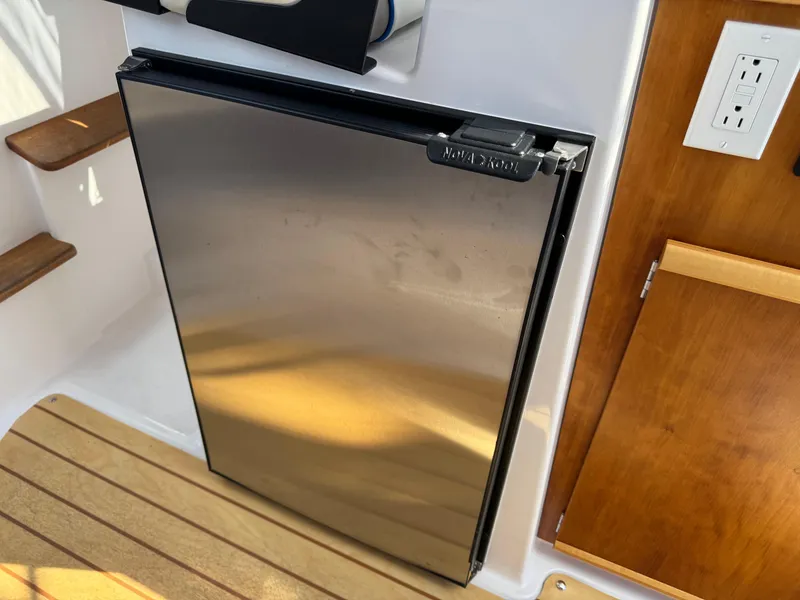 Slide: The Image of Stainless steel fridge in 2018 Cutwater C-242 Coupe boat interior. - 23