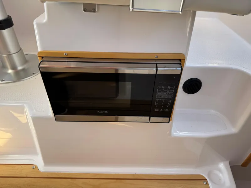 Slide: The Image of Built-in microwave in 2018 Cutwater C-242 Coupe boat interior. - 24