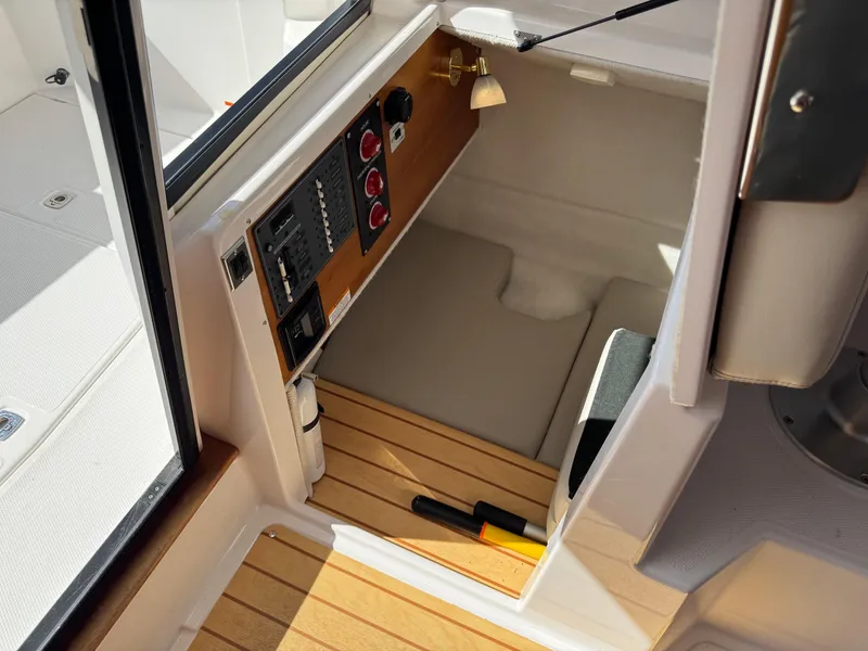 Slide: The Image of 2018 Cutwater C-242 Coupe interior with control panel and wooden flooring. - 25