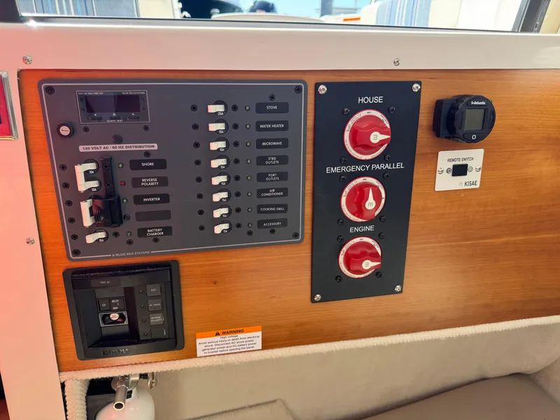 Slide: The Image of Control panel of a 2018 Cutwater C-242 Coupe boat with switches and dials. - 26