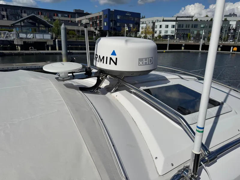 Slide: The Image of 2018 Cutwater C-242 Coupe with Garmin xHD radar, docked in a modern marina. - 29