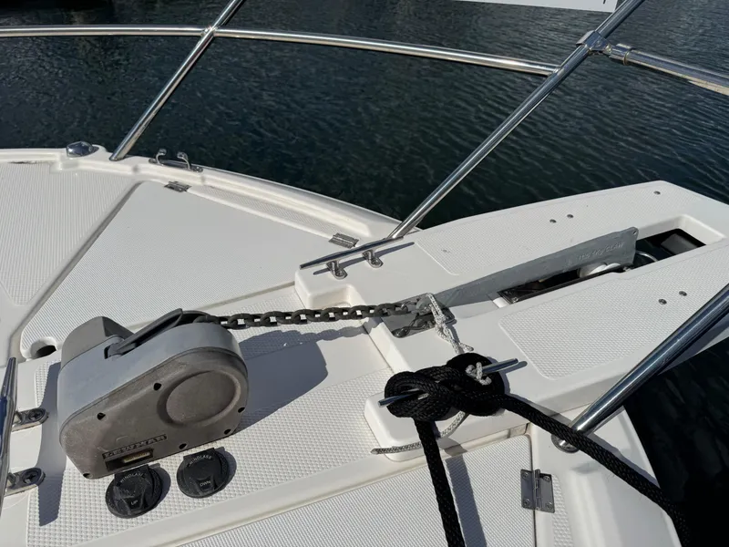 Slide: The Image of 2018 Cutwater C-242 Coupe boat anchor system on deck by the water. - 31