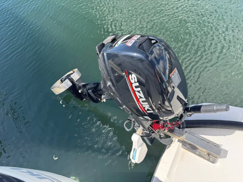 Slide: The Image of Outboard motor on a 2018 Cutwater C-242 Coupe, floating in calm water. - 33