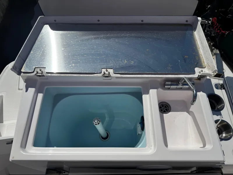 Slide: The Image of 2018 Cutwater C-242 Coupe boat sink and faucet with stainless steel cover. - 35