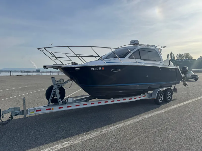 Slide: The Image of 2018 Cutwater C-242 Coupe boat on trailer in parking lot. - 39