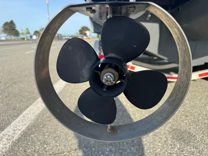 Slide: The Image of Close-up of a 2018 Cutwater C-242 Coupe boat propeller in a parking lot. - 41