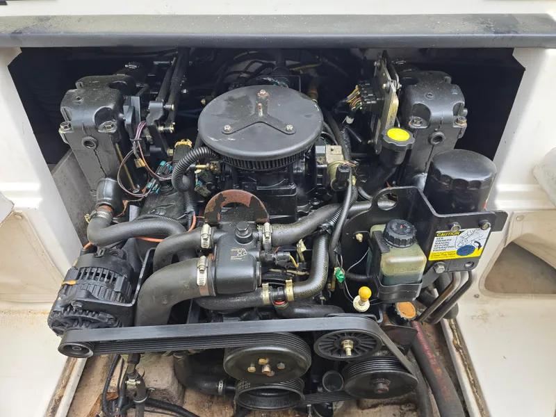 Slide: The Image of 2007 Chaparral 190 SSi boat engine, detailed view of components and belts. - 12