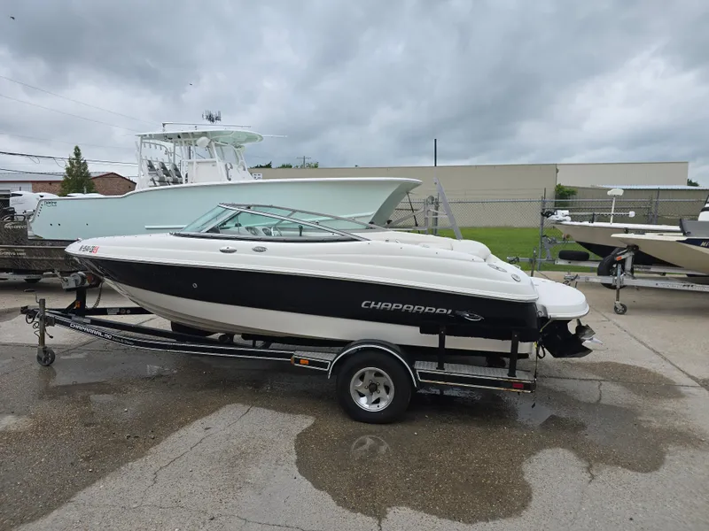 Slide: The Image of 2007 Chaparral 190 SSi boat on trailer, parked outdoors under cloudy sky. - 3