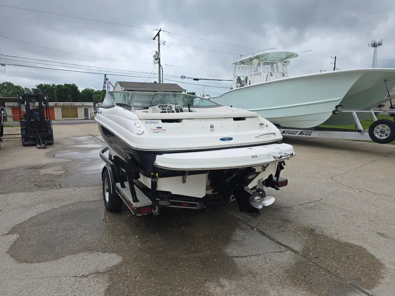 Slide: The Image of 2007 Chaparral 190 SSi boat on trailer, parked outdoors on a cloudy day. - 4