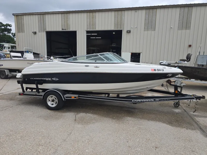 Slide: The Image of 2007 Chaparral 190 SSi boat on trailer, parked outside a warehouse. - 6