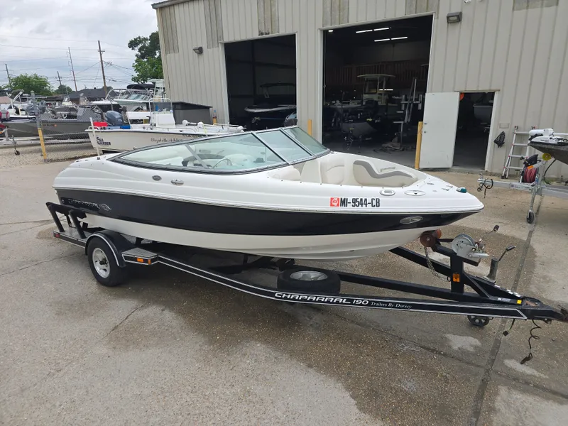 Slide: The Image of 2007 Chaparral 190 SSi boat on trailer outside a garage. - 7