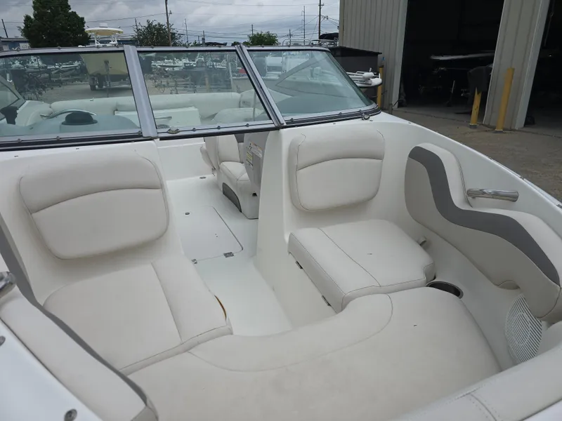 Slide: The Image of 2007 Chaparral 190 SSi boat interior with white cushioned seating and windshield. - 9