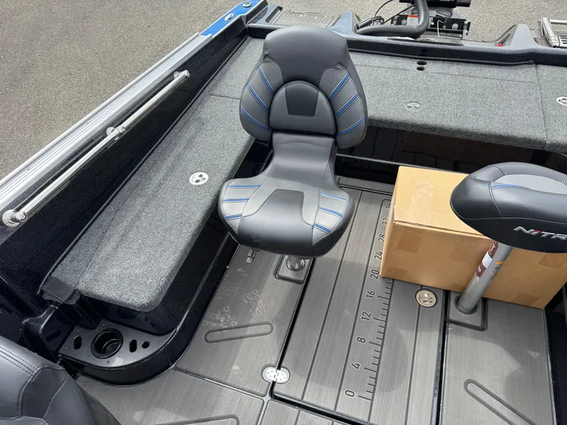 Slide: The Image of 2025 Nitro ZV21 Pro boat interior with seating and storage box. - 11
