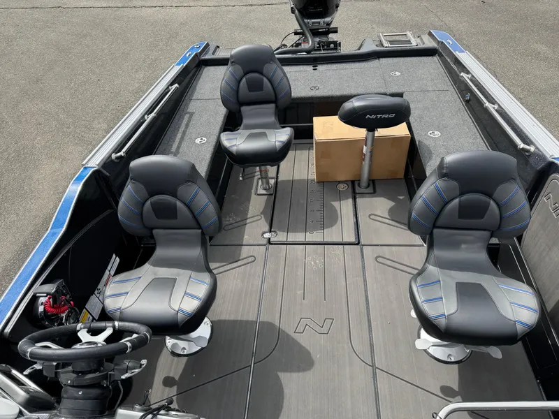 Slide: The Image of 2025 Nitro ZV21 Pro boat interior with four seats and a steering wheel. - 20
