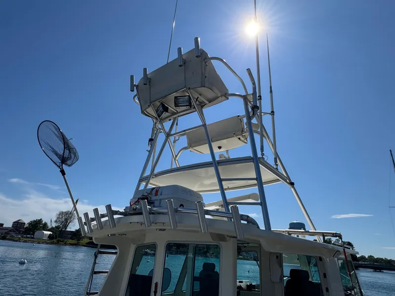 Slide: The Image of 2009 Northern Bay 36 boat with tower and fishing net under clear blue sky. - 12