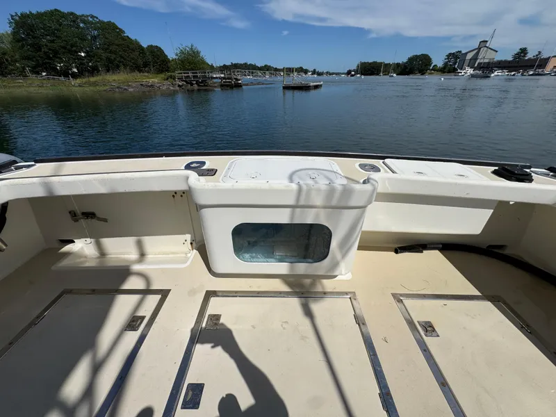 Slide: The Image of Northern Bay 36 boat deck, 2009 model, overlooking serene waters and distant shoreline. - 16