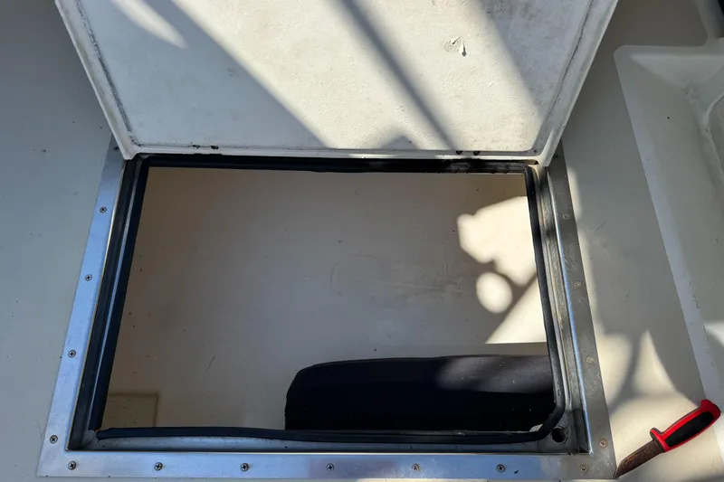 Slide: The Image of Open hatch on 2009 Northern Bay 36 boat deck with visible shadows. - 23