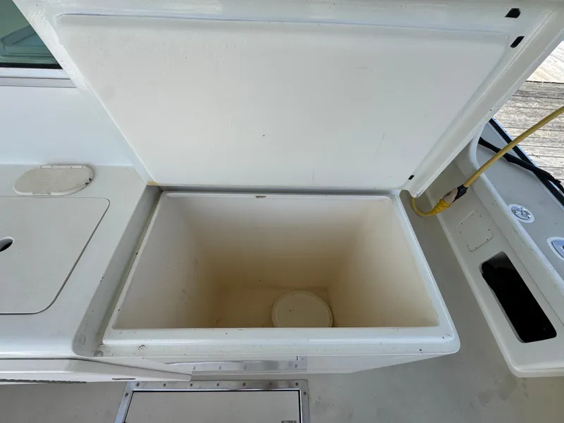 Slide: The Image of Open storage compartment on a 2009 Northern Bay 36 boat deck. - 31