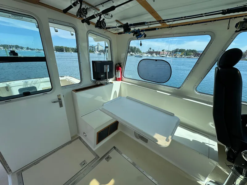 Slide: The Image of Interior of 2009 Northern Bay 36 boat with seating, table, and scenic water view. - 41