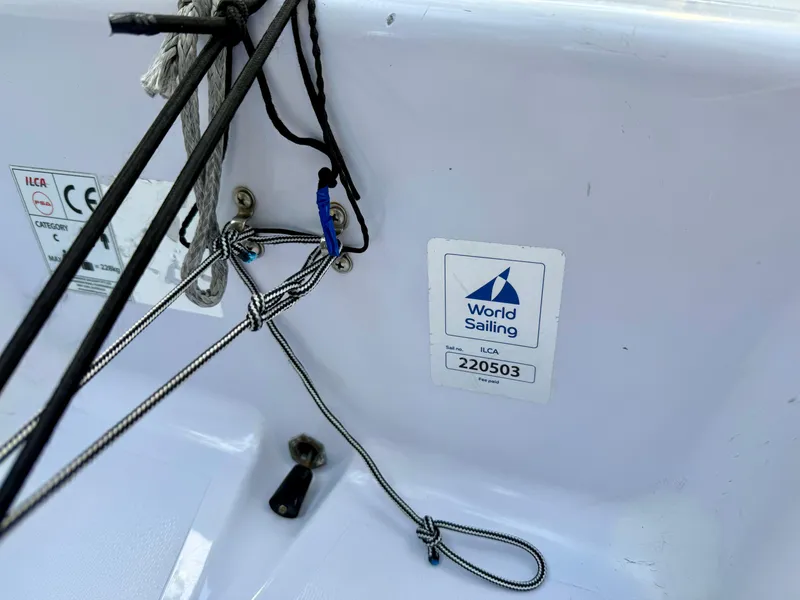 Slide: The Image of 2023 Dinghy PSA ILCA 6 with World Sailing certification sticker and rigging details. - 3