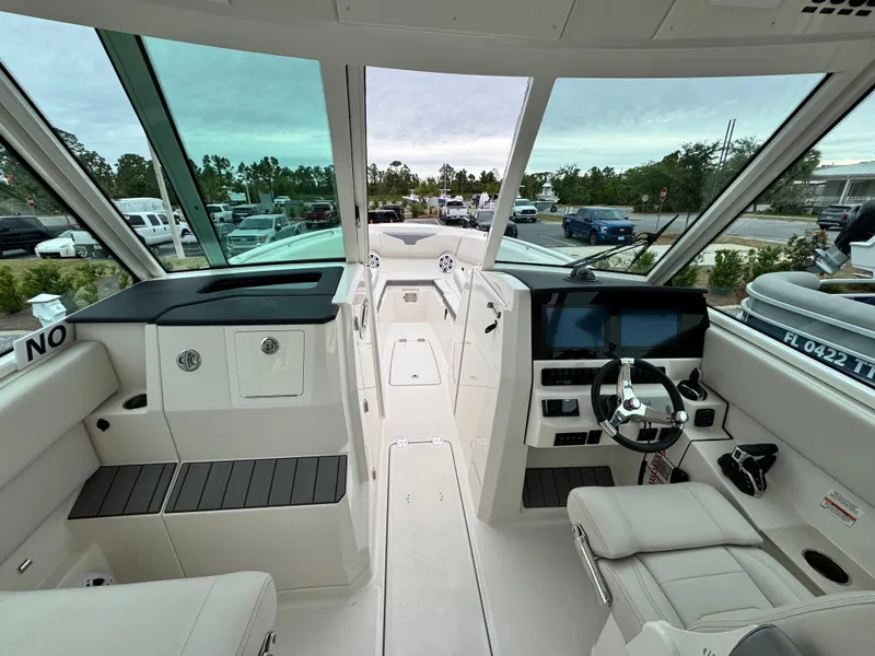 Slide: The Image of 2025 Sailfish 316 DC boat interior with modern dashboard and seating. - 10