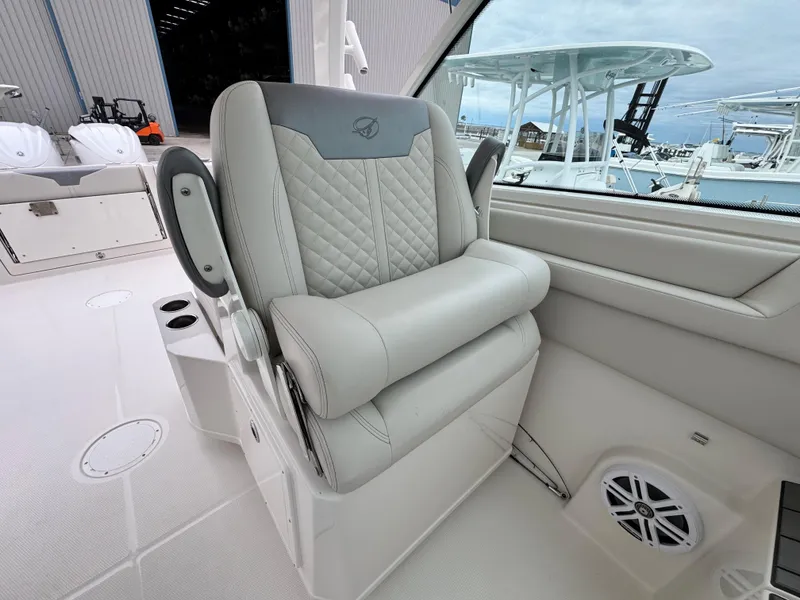 Slide: The Image of Luxury seating on 2025 Sailfish 316 DC boat, featuring quilted upholstery and modern design. - 16