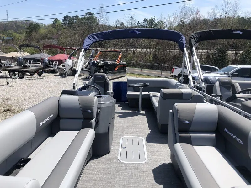 Slide: The Image of 2025 Bennington S L-Bench 20 SL pontoon boat with spacious seating and canopy. - 4