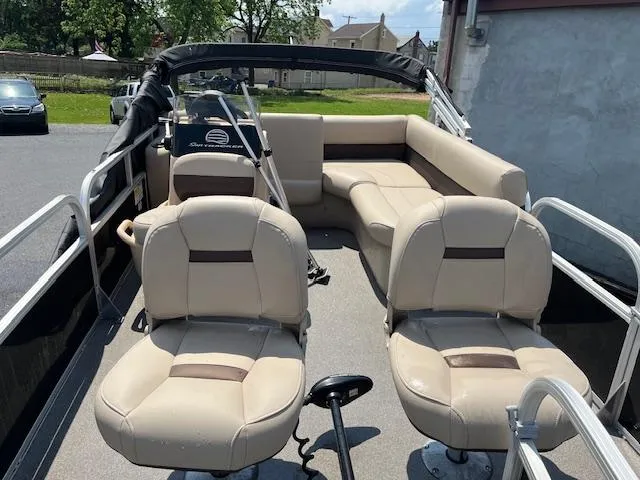 Slide: The Image of 2018 Sun Tracker Bass Buggy 16 DLX pontoon boat with beige seating and steering console. - 12