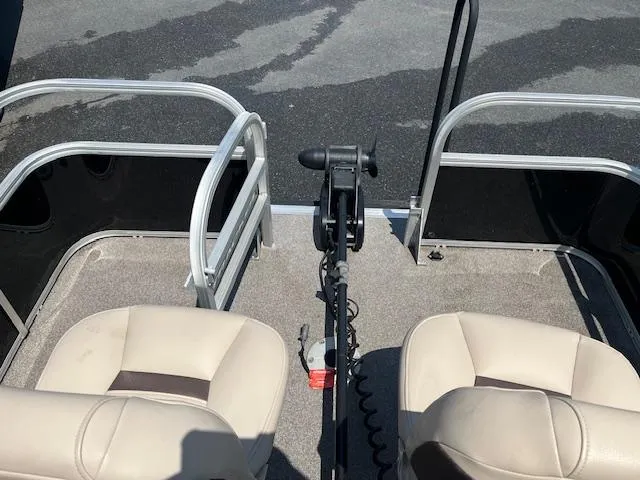 Slide: The Image of 2018 Sun Tracker Bass Buggy 16 DLX interior with two seats and a trolling motor. - 3