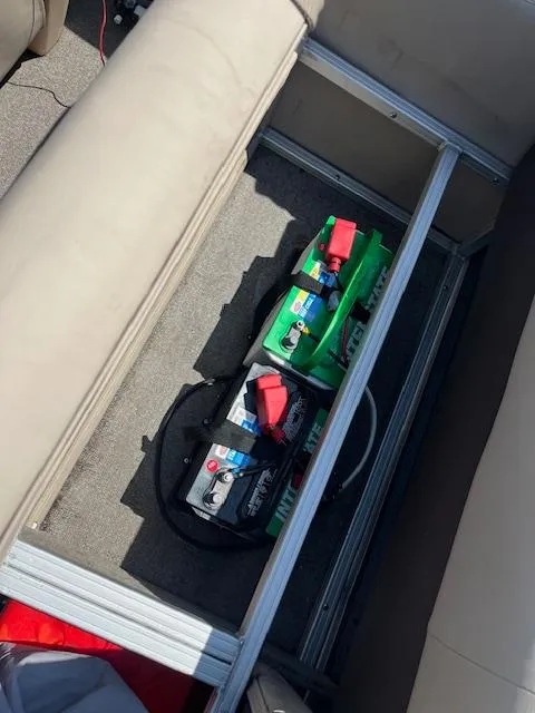 Slide: The Image of 2018 Sun Tracker Bass Buggy 16 DLX boat battery compartment with two batteries. - 9