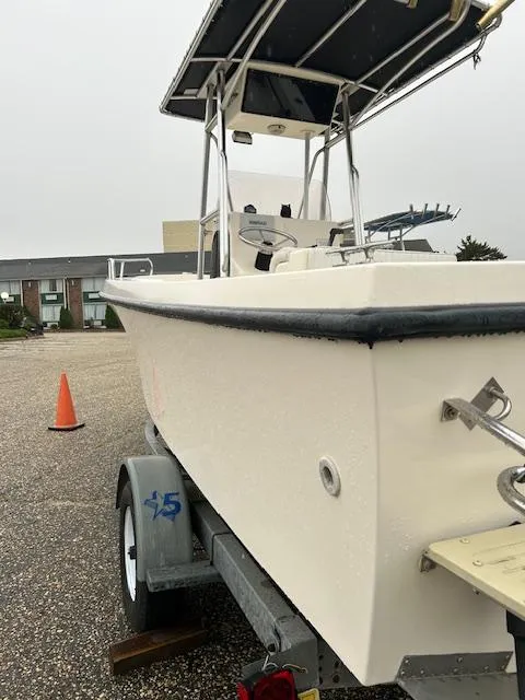 Slide: The Image of 2007 May-Craft 2300CC boat on trailer, parked outdoors, with overcast sky. - 10